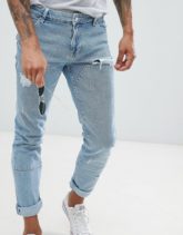 ASOS DESIGN - Enge Jeans in leicht verwaschenem Blau mit eingesetzten Stoffteilen