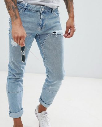 ASOS DESIGN - Enge Jeans in leicht verwaschenem Blau mit eingesetzten Stoffteilen