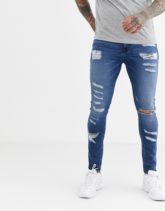 ASOS DESIGN - Spray-on-Jeans aus Power-Stretch mit starken Rissen in verwaschenem Mittelblau