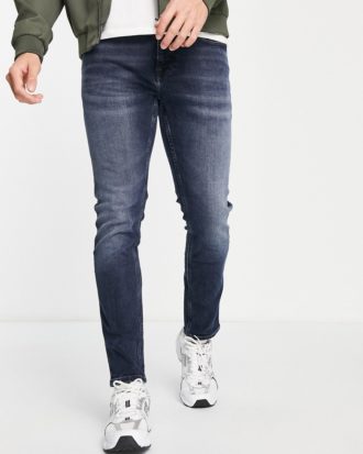 Tommy Jeans - Austin - Schmal geschnittene und schmal zulaufende Jeans in dunkler Waschung-Blau